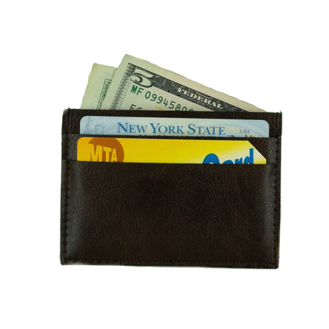 A small cardholder made of dark brown vegan leather. 2 card slots on each side and a center slot, rectangular shaped. Shown here with cards and cash inside.